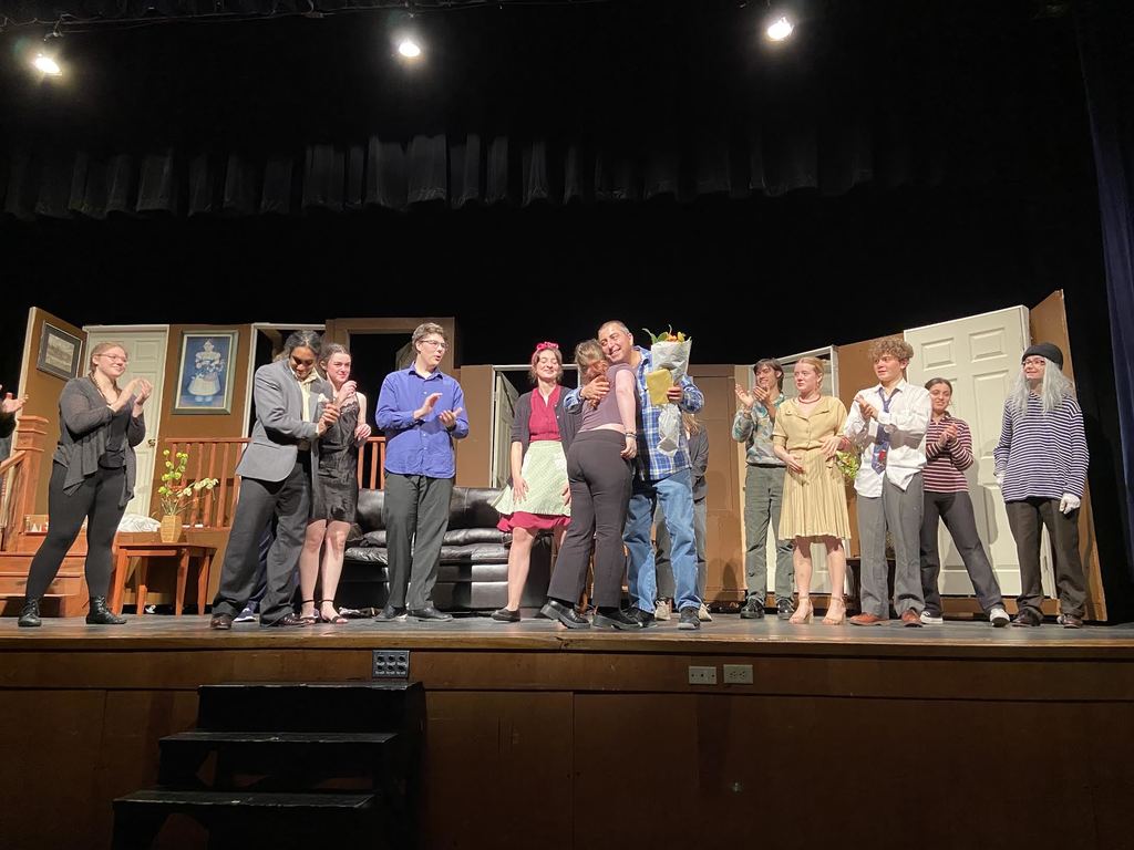 Mr. Solomon receives flowers from the cast and crew.